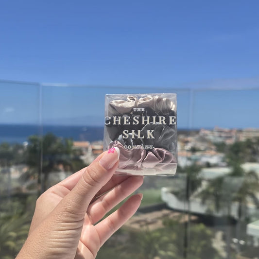 Luxury Mulberry silk scrunchie gift boxes with Tenerife ocean backdrop